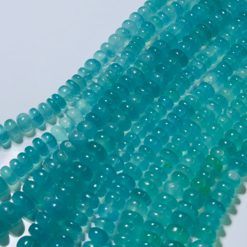 Close-up of turquoise beads on a white background