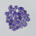 Purple gemstones on a light gray background