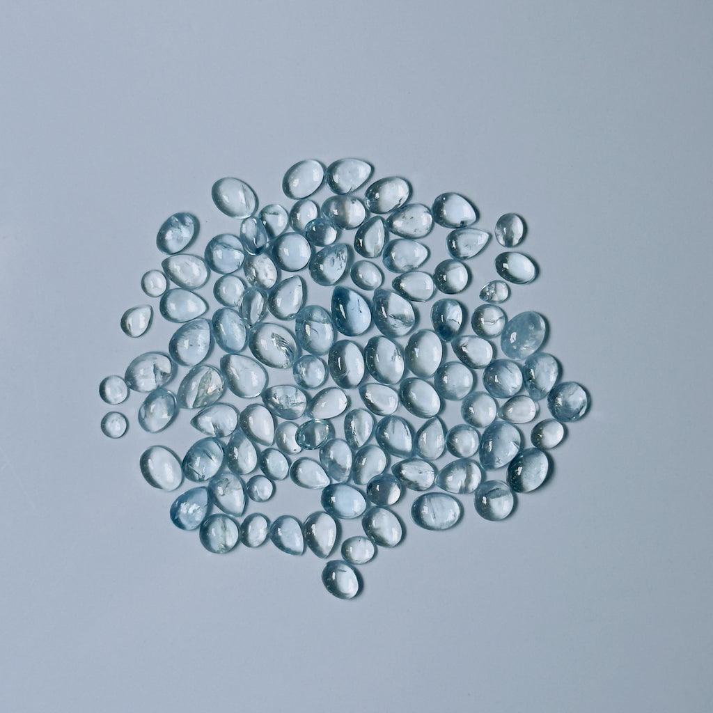 Clear Blue glass beads on a white background
