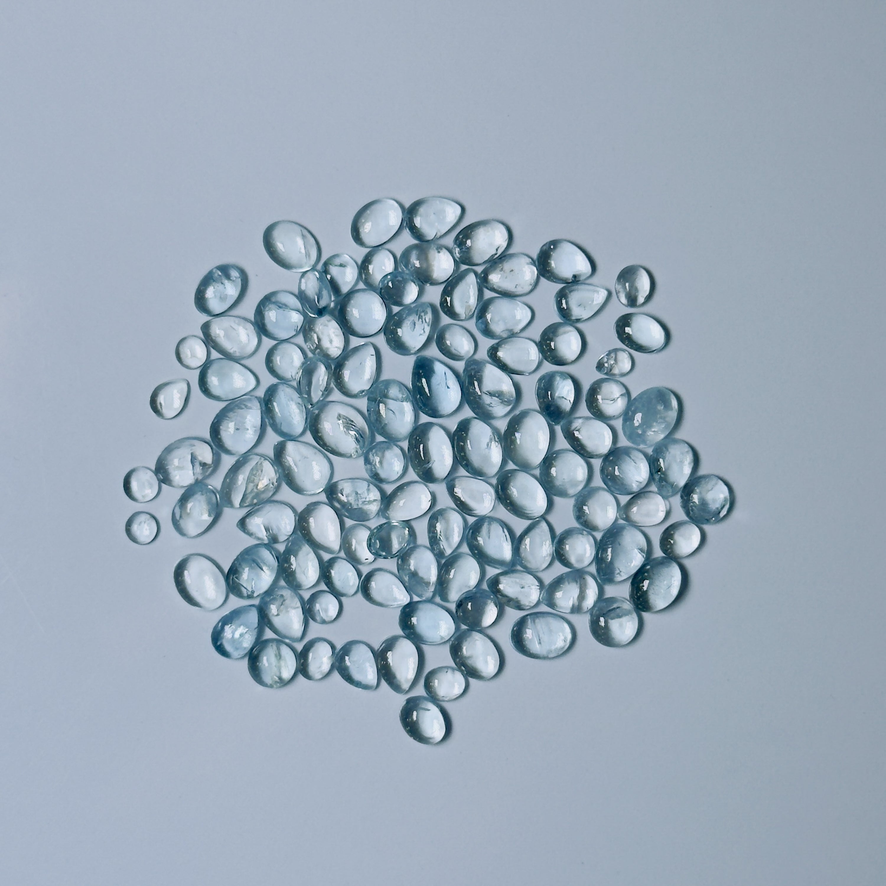 Clear Blue glass beads on a white background