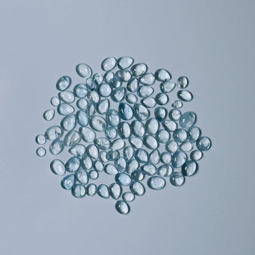 Clear Blue glass beads on a white background