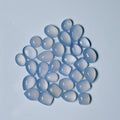 Blue teardrop-shaped stones on a light blue background