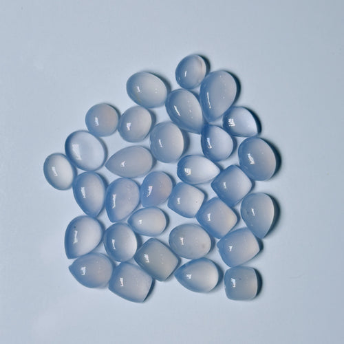 Blue teardrop-shaped stones on a light blue background