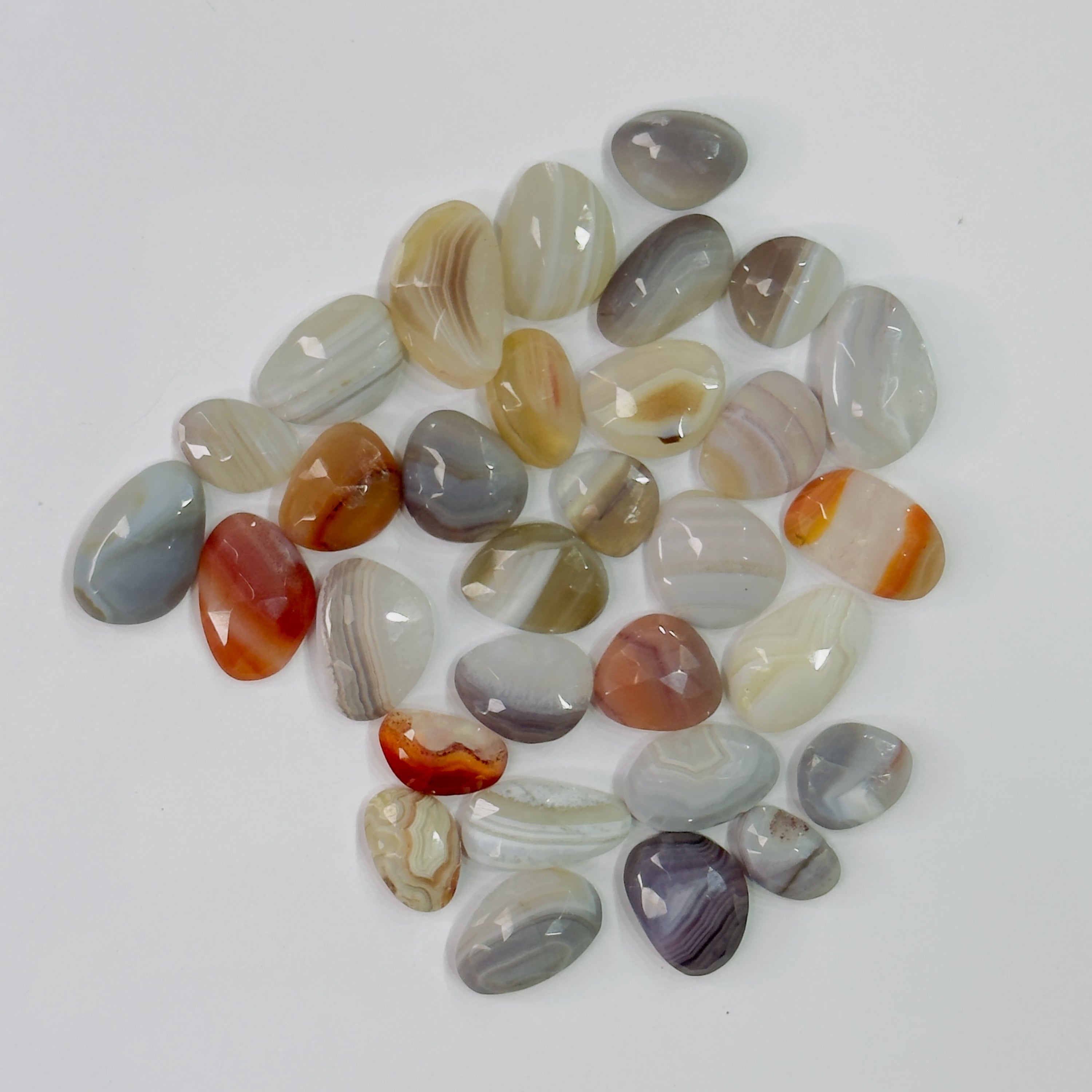 Collection of multicolored stones on a white background