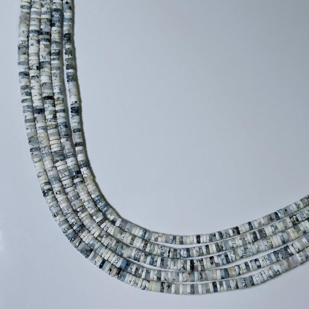 Necklace with small, multicolored beads on a light gray background