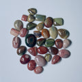 Collection of multicolored stones on a White background