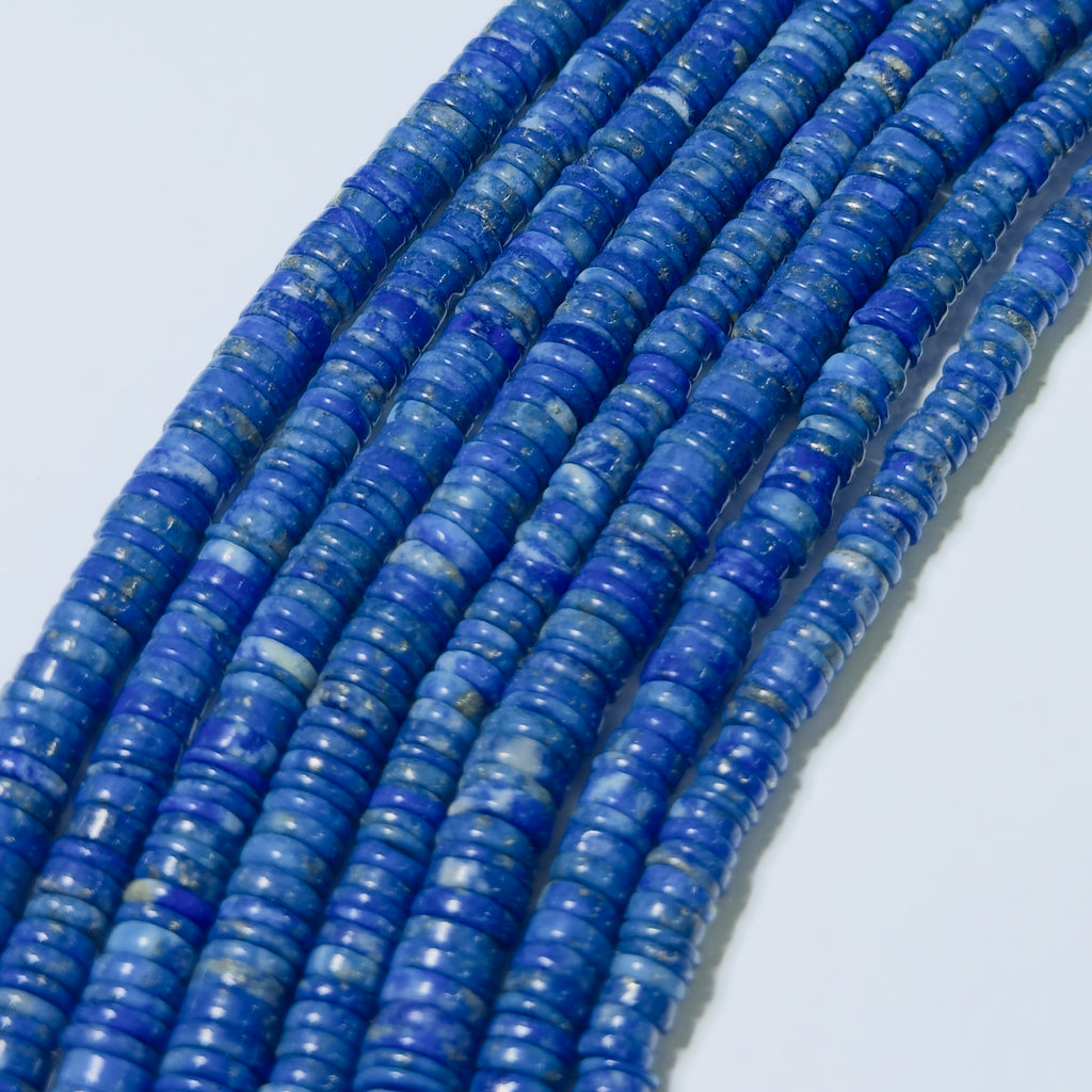 String of blue beads on a light gray background