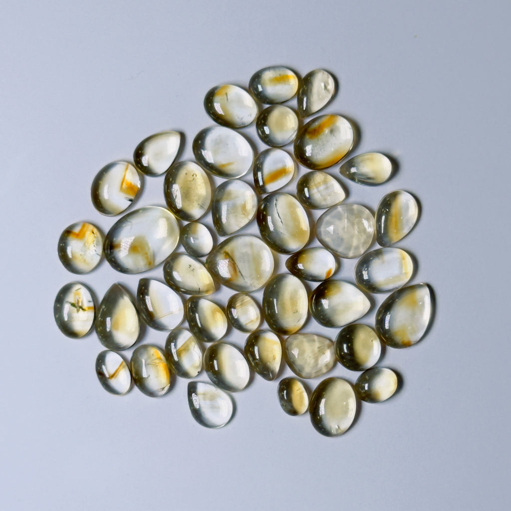  Light yellow glass stones on white background