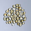  Light yellow glass stones on white background