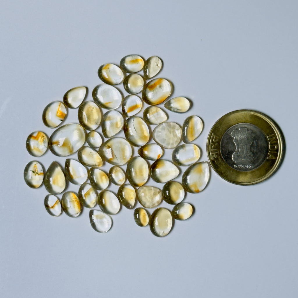 Light yellow glass stones on white background