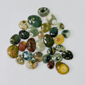 Collection of multicolored gemstones on a white background