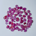Pink gemstones on a light gray background
