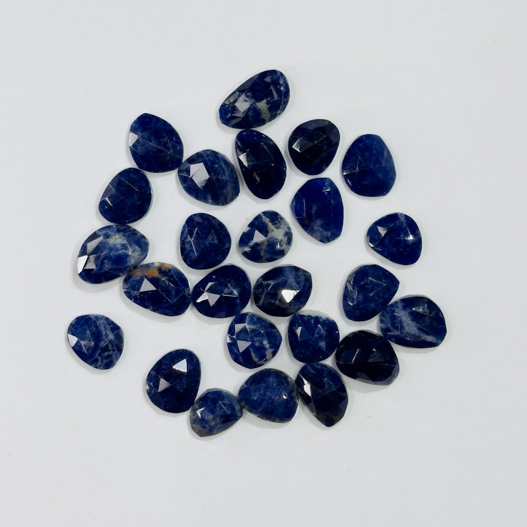 Collection of blue gemstones on a white background