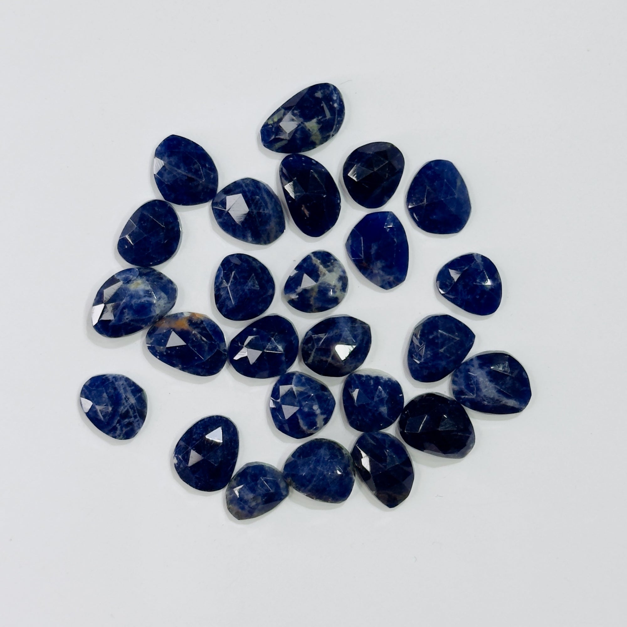 Collection of blue gemstones on a white background