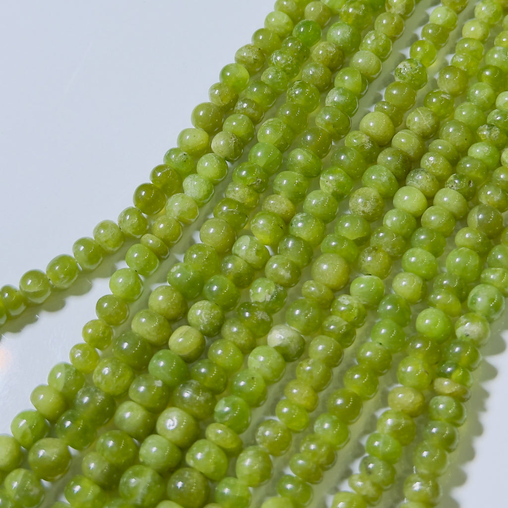 Green beads on a white background