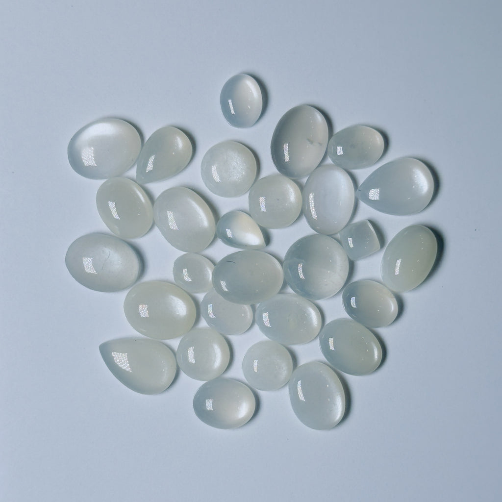 Collection of  White teardrop-shaped stones on a White background