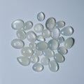 Collection of  White teardrop-shaped stones on a White background